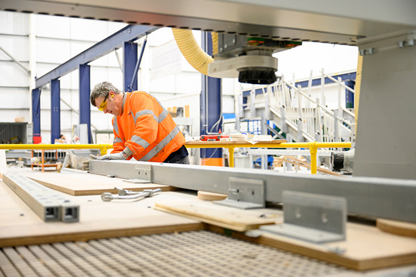 Commercial photography of a skilled engineer working in a manufacturing facility, demonstrating industrial brand storytelling